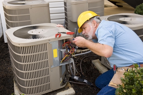technician working on HVAC unit